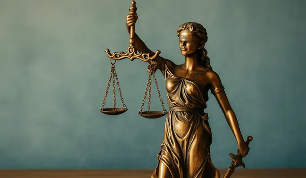 the statue of lady justice from Menes Lemon Law Firm in Miami, FL - Lemon law for used vehicles